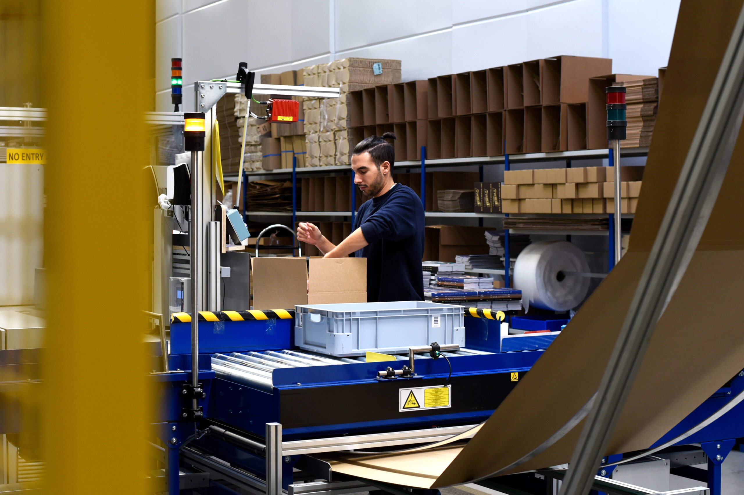 Person working in warehouse packing orders