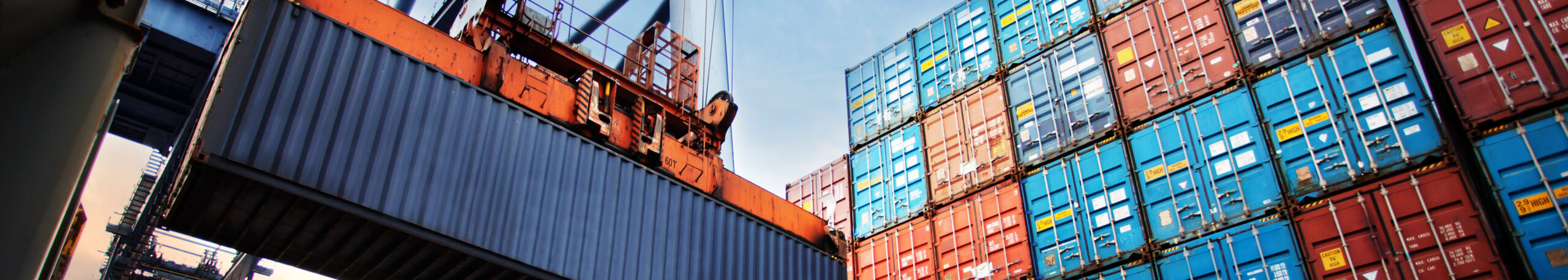 Shipping containers being moved by crane